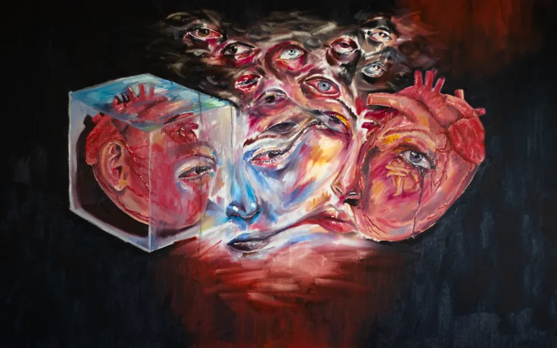 'Love': melting faces, many eyes, a heart and a glass cube on black