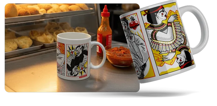 Santo Subversivo! mug with saint-and-devil playing cards, on a bakery counter