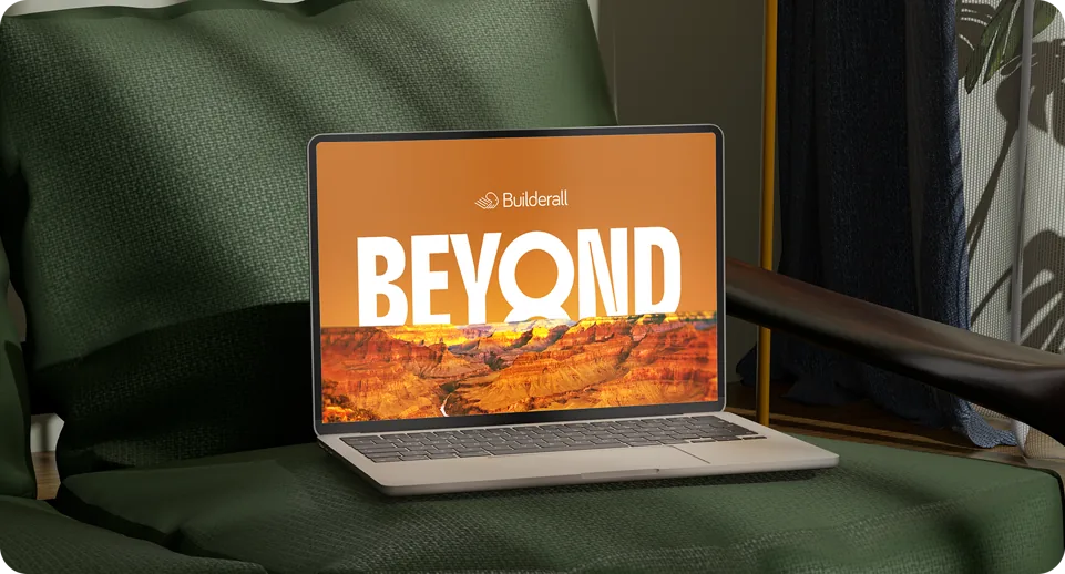 Laptop on an armchair showing the BEYOND page over a canyon