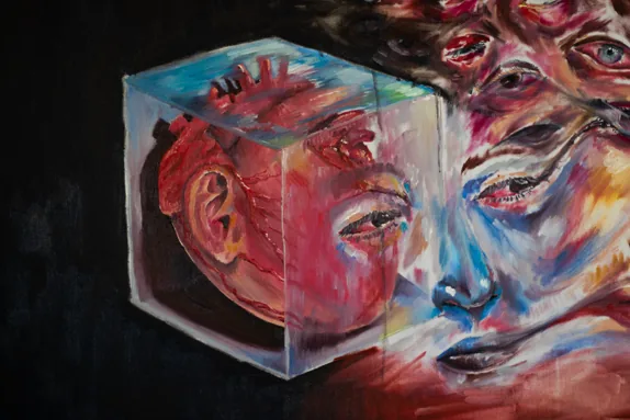 Detail of 'Love': a head trapped inside a glass cube