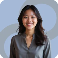 Persona portrait: smiling woman in a gray blouse on light blue
